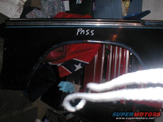 Black fender with blue trim and "PASS" written on it