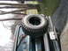 1994 Ford Bronco - Spare tire mounted on the rear of an SUV, with a visible license plate.