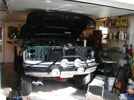 1994 Ford Bronco front view with hood open and aftermarket bumper with lights