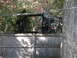 1994 Ford Bronco - Vehicle frame suspended outdoors, possibly for painting or repair.