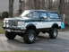 1994 Ford Bronco - This lifted Ford Bronco features a two-tone paint scheme and off-road modifications.