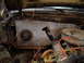 1981 Ford Bronco - The engine bay of a 1981 Ford Bronco shows the firewall with exposed wiring and engine components.