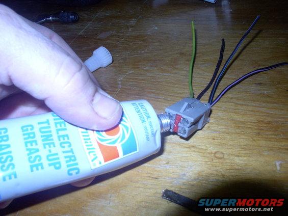img_0016.jpg Now stuff the plug with dielectric grease to keep future corrosion from starting and promote conductivity as well as making it easy to slide in and out of the female connector.