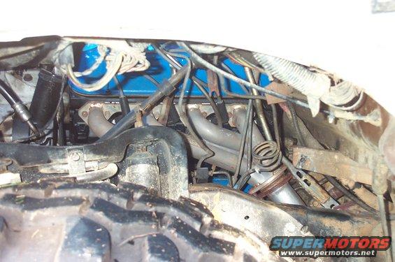 Engine with headers and blue valve cover