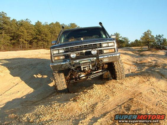 1989 Chevrolet Blazer with snorkel and winch driving off-road