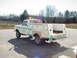 1973 Ford F-250 - This utility truck features a custom service body with multiple compartments and emergency lights.