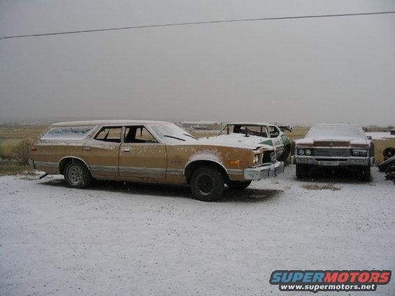 1973 Ford Wagon and two other station wagons covered in snow
