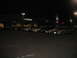 2002 Ford Taurus - Several cars are parked in a lot at night, with a Cambridge store in the background.