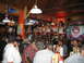 2002 Ford Taurus - A lively scene inside a Hooters restaurant, waitresses on a stage and patrons enjoying themselves.