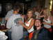 2002 Ford Taurus - A group of people are gathered inside a Hooters restaurant.