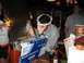 2002 Ford Taurus - People gathered around a table, one person wearing a foil crown, with food service foil prominently displayed.