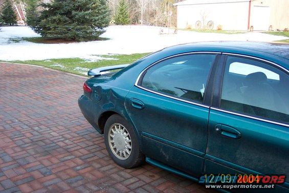 Teal 1996 Mercury Sable sedan rear view with spoiler