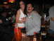 2002 Ford Taurus - A couple poses for a photo at a bar, with the woman wearing a Hooters uniform and the man in a gray sweatshirt.