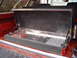 1985 Ford Bronco - Lid of the box is raised with spring assist gas charged cylinders.