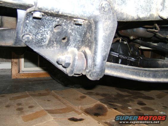 Close-up of vehicle suspension bracket and sway bar mount