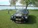 1978 Ford Mustang II - This 1978 Ford Mustang II Cobra II features distinctive gold racing stripes and is parked in a scenic lakeside setting.