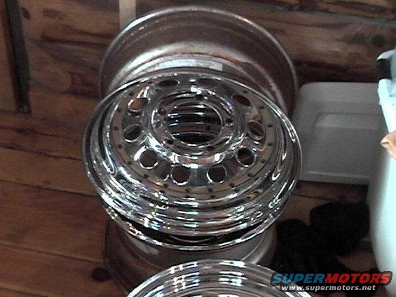 stack of shiny chrome wheels