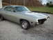 1971 Ford Torino - This silver coupe, likely from the early 1970s, is missing its front grille and bumper components.