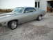 1971 Ford Torino - This 1971 Ford Torino coupe features a silver paint job with a subtle red pinstripe accent.