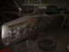 1971 Ford Torino - A car body, possibly a 1970s model, is undergoing restoration with visible primer and rust.