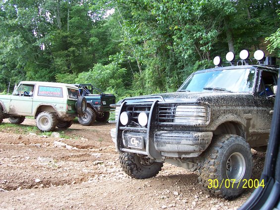 Black off-road truck front view with brush guard and auxiliary lights