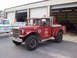 1973 Ford F-250 - This red fire truck, marked 'ASBURY REHOBOTH', is parked outside a fire station next to another vehicle.