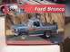 1979 Ford Bronco - A model kit box displays a blue 1979 Ford Bronco with off-road accessories and graphics.