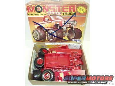 Monster Truck Ford Bronco model kit box with red plastic parts and tires inside the box
