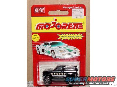 Black toy SUV with white stars on its side, in blister pack