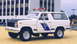 1979 Ford Bronco - This white SUV, likely a 1978 model, is equipped with emergency lights and a distinctive side decal.