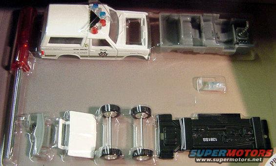 White police SUV model kit with "SHERIFF" and "STAY BACK!" text