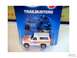 1979 Ford Bronco - A white toy truck with flame decals and a camper shell is displayed in its original packaging.