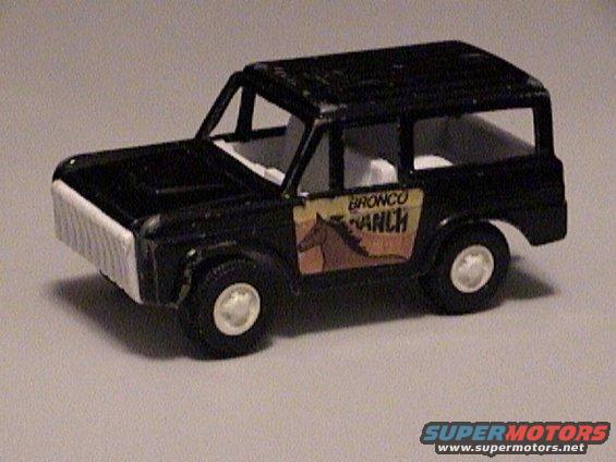 Black toy SUV with a white grille and a decal reading "Bronco Ranch" with a horse