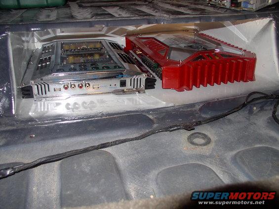 img_0087.jpg Both amps fit in there and the carpet will still cover the front hole perfectly.