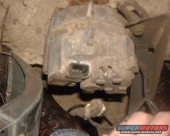 Alternator with a black connector and yellow wire