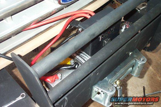 Winch and bumper assembly with red cables and T-MAX branding