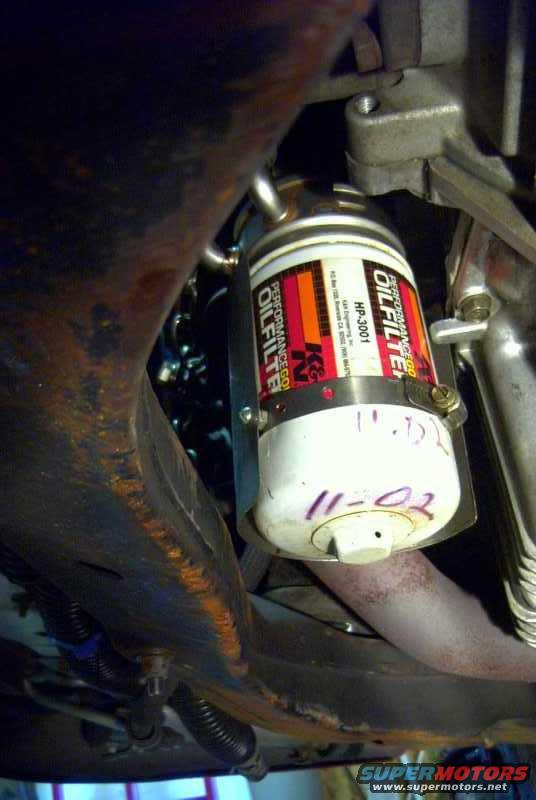 oil-filter-shield.jpg A heat shield for the filter made from SS and a hose clamp.  It is off set with some small nuts so there is no contact.