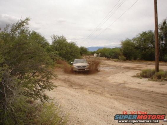 MY BUDDY DOUG'S F150 PLAYIN IN THE MUD.