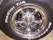 1978 Ford Mustang II - Close-up of a chrome wheel and BFGoodrich Radial T/A tires, with text visible on the tire sidewall.