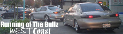 three sedans driving, one gold, one silver, one black. Text overlay says 'Running of The Bullz WEST Coast'