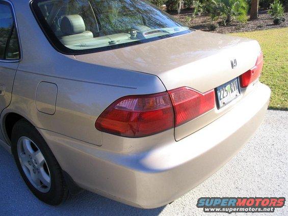 Rear quarter view of a tan 2000 Honda Accord sedan. License plate reads 225 RVV