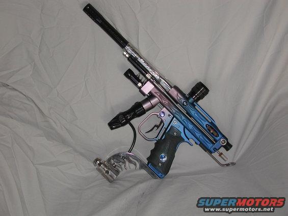 Paintball gun with blue and purple flame design, black grip, and chrome accents