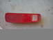 1978 Ford Bronco - This red taillight assembly features a ribbed lens and a clear section for the bulb.