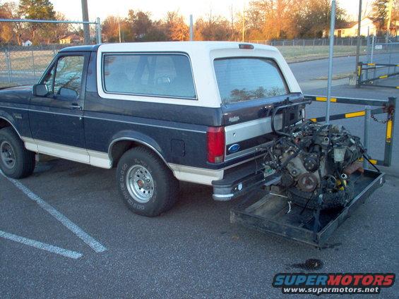 15-loaded.jpg The 2000 Grand Marquis 4.6L that will be going into my '94 CV strapped to my hitch hauler behind my brother-in-law's '93 EB Bronco.

Yeah, it dragged the ground in a few places...  His rear springs are collapsed & his receiver is low under the bumper.