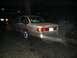 1999 Ford Crown Victoria - This sedan has significant rear-end damage, with the bumper hanging off and smoke emitting from the undercarriage.