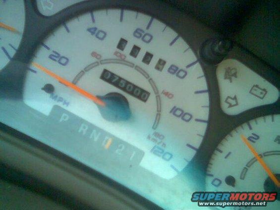 Dashboard gauges with odometer reading 075000 and PRND21 indicator