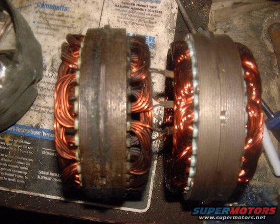 Two copper-wound alternator rotors side-by-side on a workbench with text in the background