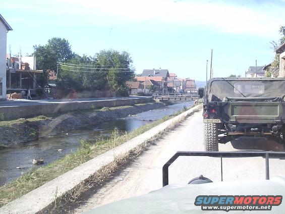 town of Vitina creek that runs thru it. Those are not rocks but mostly trash!!