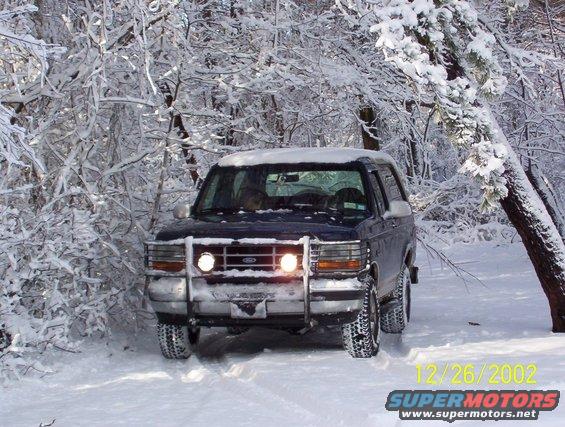1994 Ford Bronco front view in snow-covered woods