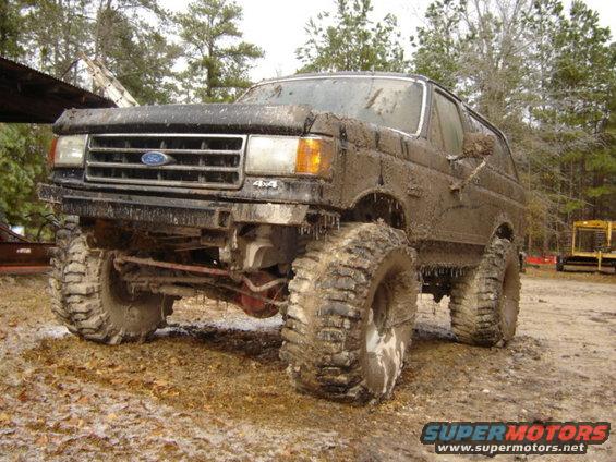 muddy Ford Bronco with big tires, looks like it's been off-roading